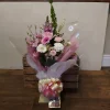 Bouquet of flowers in water with free chocolates