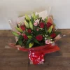 Bouquet of lilies and red roses